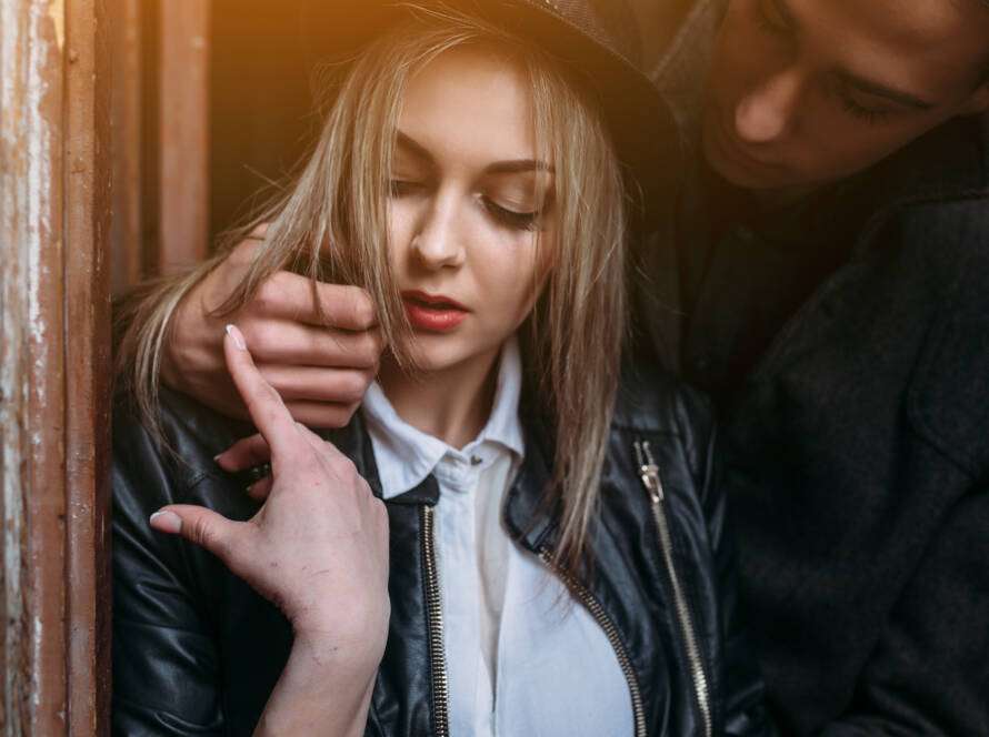 Person appearing distressed during a tense and controlling interaction in a relationship